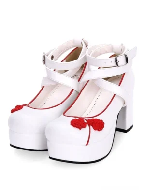 Red embroidered lolita cross-strap platform pumps with red shoe collar trim and floral embroidery, front three-quarter paired view displaying chunky heel and ankle buckle fastening details