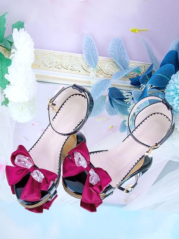 Lolita pointed toe sandals black leather burgundy satin bow side flat lay view with floral frame backdrop