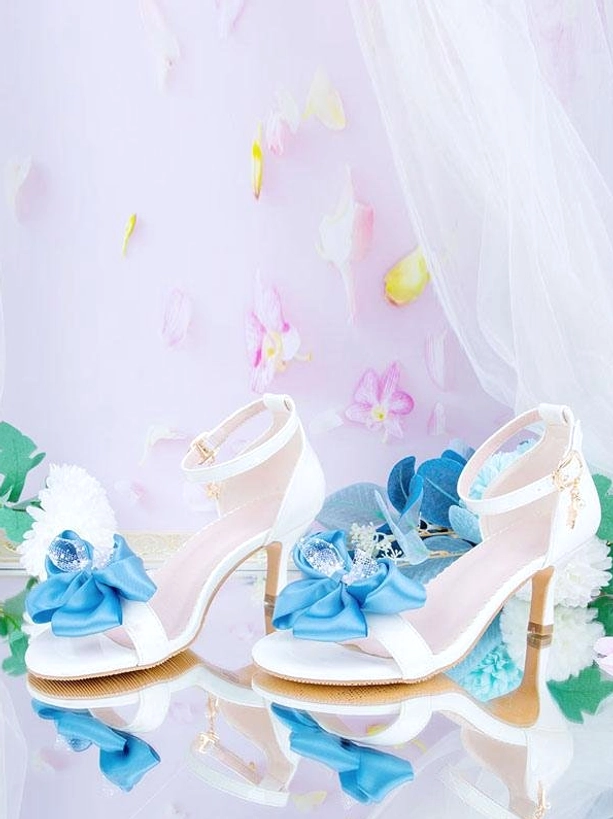 Sweet lolita high heel sandals white leather blue satin bow flat lay top-down view with mirrored reflection