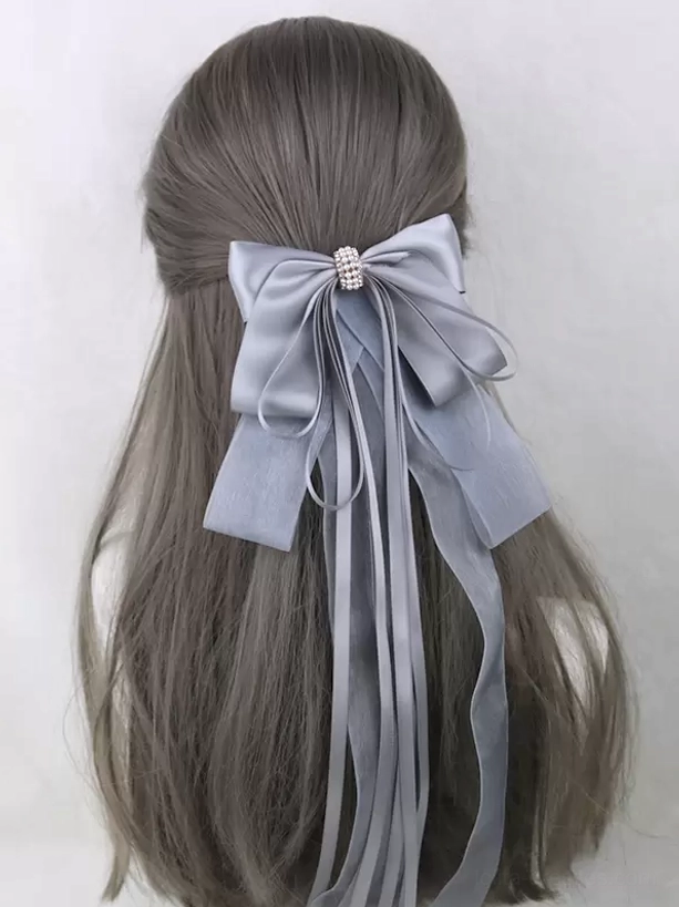 Multiple color variations of sweet lolita satin bow hair accessories with rhinestone embellishments arranged to show full palette range
