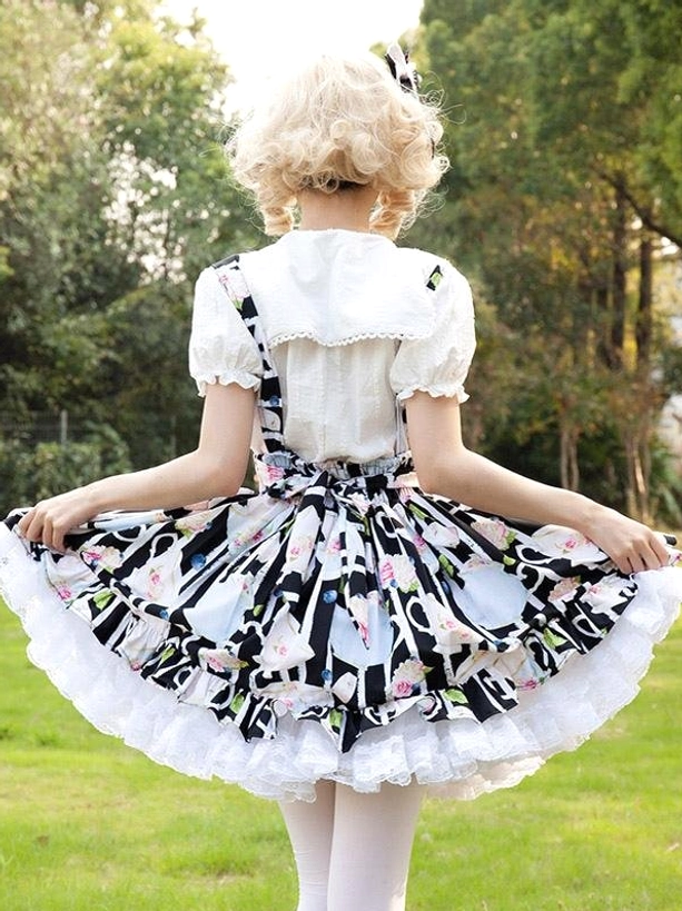 Lolita suspender skirt back view featuring waist bow detail and peter pan collar blouse, showing coordinate styling