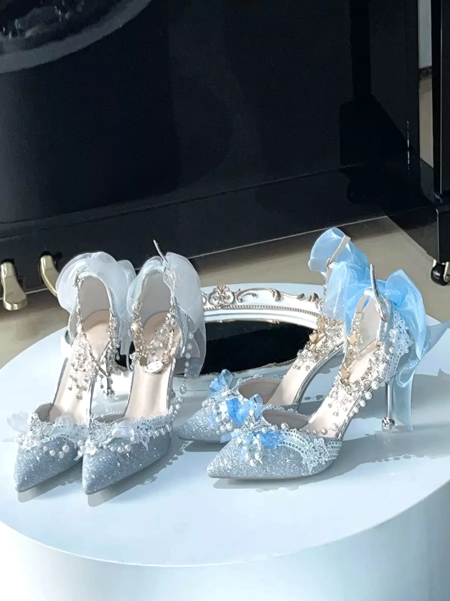 Blue and red accent Lolita pointed toe stiletto shoe with pearl decorative chain heel profile view