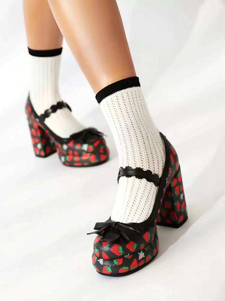 Strawberry print lolita chunky pumps with black bow, black ankle strap, strawberry graphic on heel, single side foot view