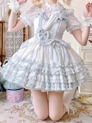 White pastel blue lolita dress kneeling full body view lace stand collar puff sleeves ruffled skirt satin bows