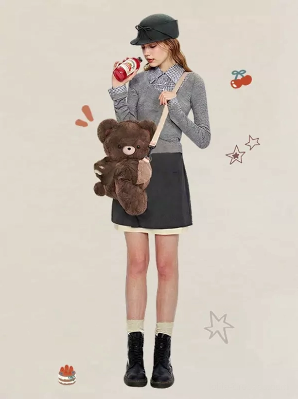 Full-body model shot wearing brown teddy bear plush lolita crossbody bag styled with gray top, dark skirt, black boots and lolita accessories