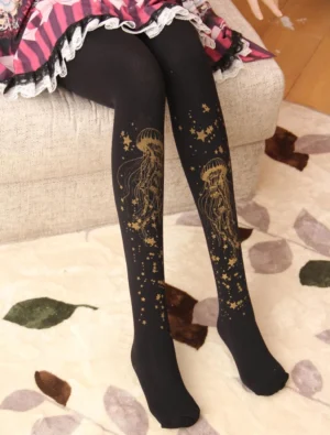 Black velvet Lolita pantyhose with gold jellyfish pattern seated side view pink plaid dress