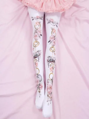 Sweet lolita pink floral printed tights worn with ruffled skirt overhead top-down view showing white base with pink flowers and vintage metal prints