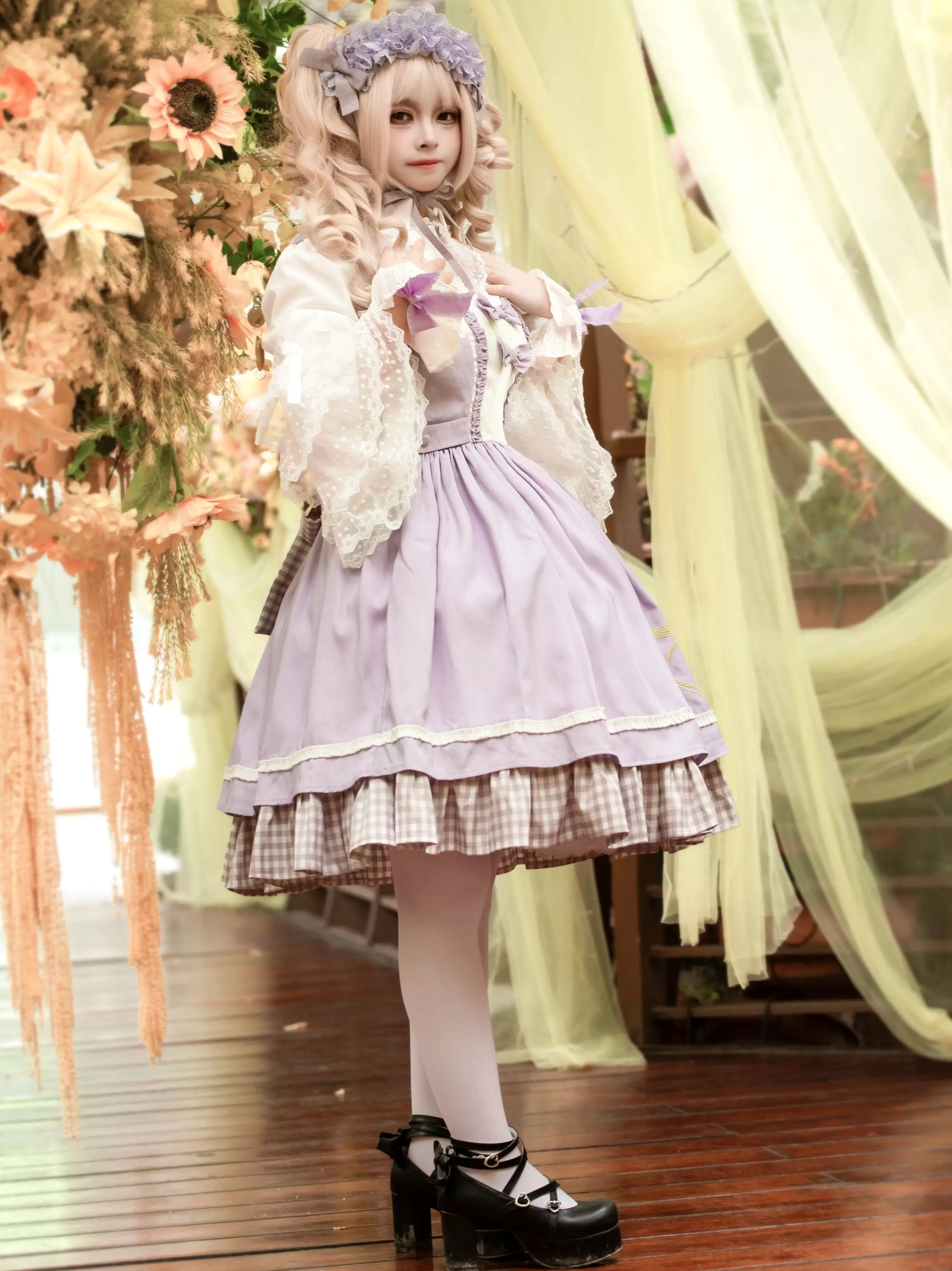 Lolita dress side front view showing flared A-line silhouette lace sleeves and delicate violin embroidery on model