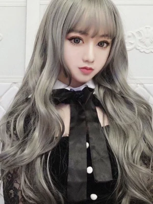 Long wavy lolita synthetic wig with ash silver grey color and air bangs front close-up view worn with gothic lace-trimmed outfit