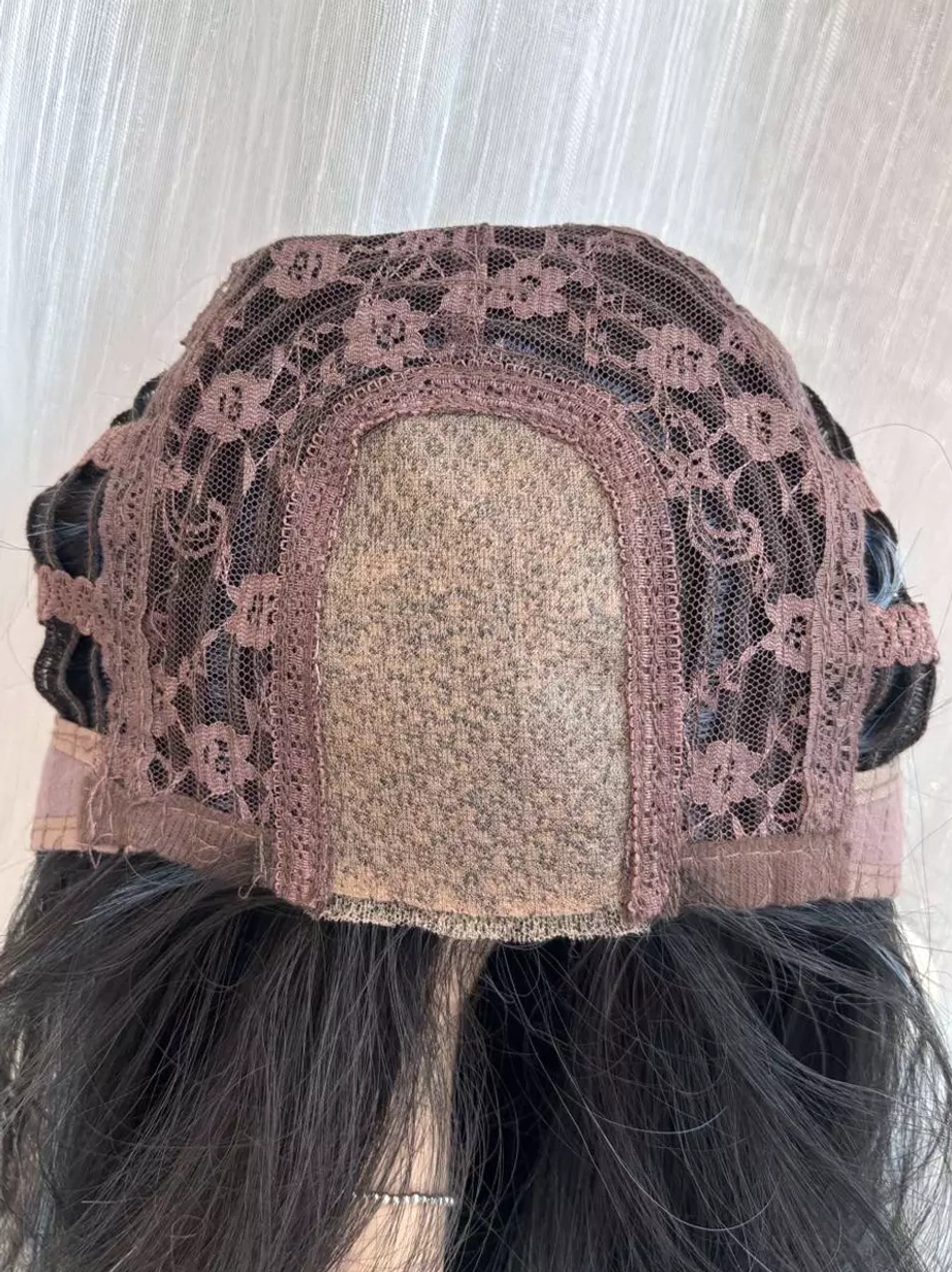 Wig cap base construction top-down rear view showing floral lace cap and elastic adjustment band
