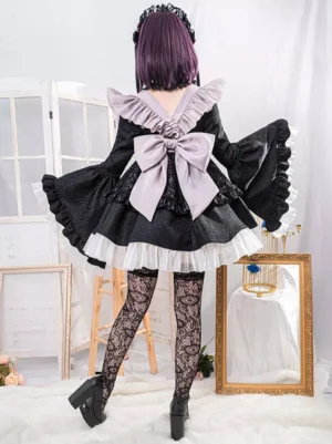 Maid gothic lolita dress set back view with oversized bow fishnet stockings platform heels