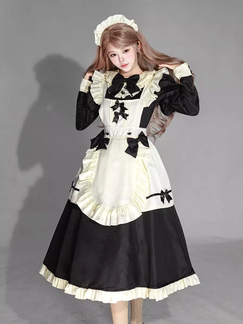 Maid lolita dress close-up view of apron front layered ruffles and decorative bow placement