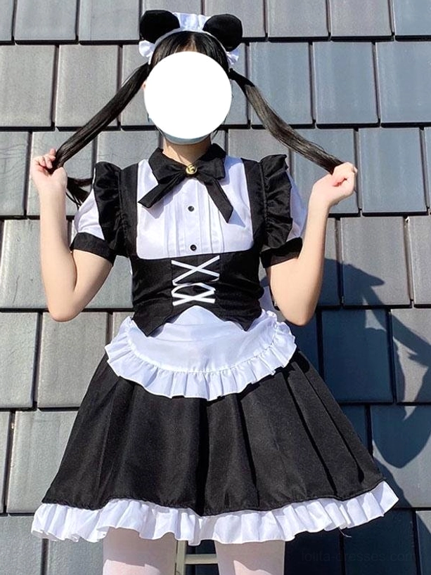 Black and white maid lolita dress front flat lay view featuring ruffled skirt hem, lace-up bandage waist design, puff short sleeves, and bow necktie on faceless model with cat ear headwear against tile roof background