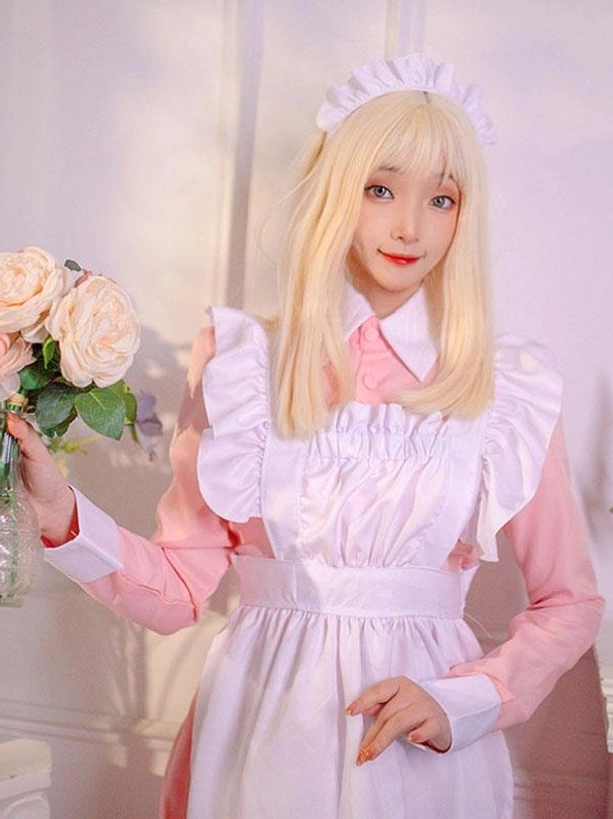 Maid lolita dress close-up with headwear and ruffled shoulder apron detail holding flower bouquet prop