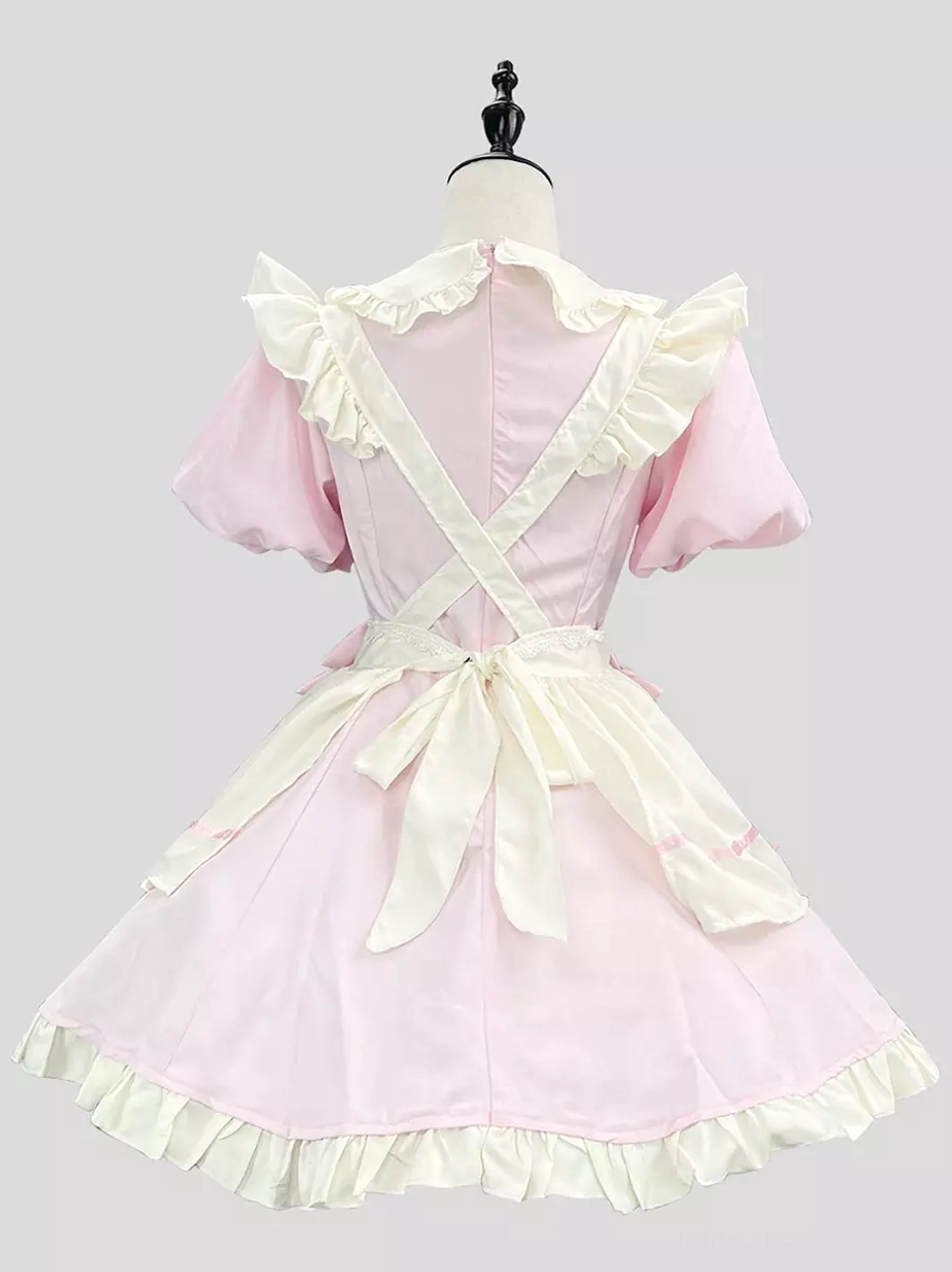 Back view of pink and white maid lolita dress on mannequin with cross back straps and large satin waist bow