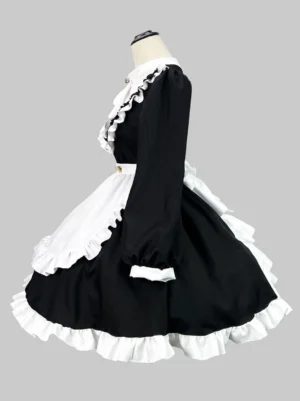 Maid style lolita dress side view displaying long puff sleeves layered ruffled skirt hem and white apron detailing grey background
