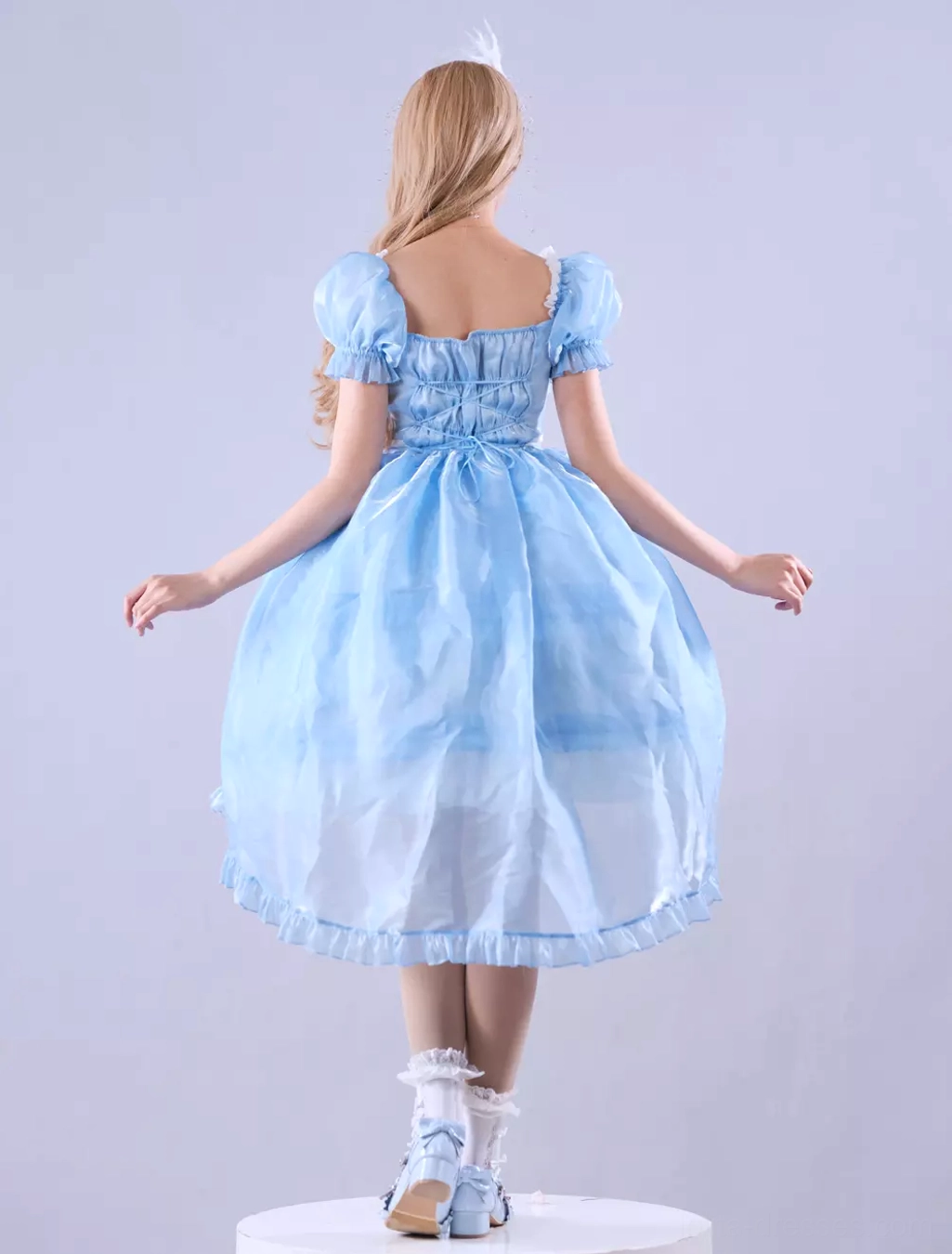 Matching floral bonnet that coordinates with sky blue lolita dress, showing delicate flower embellishments and ribbon trim details perfect for themed coordination