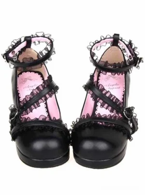 Matte black Lolita chunky heel shoes front view, featuring crisscross lace-trimmed ankle straps, metal buckle fasteners, and round toe design, studio photography on white background