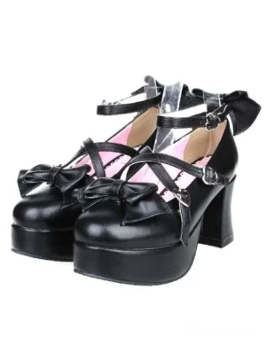Matte black Lolita platform heels with bow embellishments and cross buckle ankle straps, front three-quarter view showcasing pink interior lining and chunky platform heel
