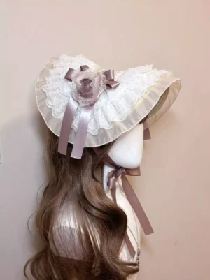 Elegant mauve rose garden lolita bonnet headdress with white scalloped lace trim and satin ribbon ties displayed on mannequin side back view showcasing layered lace frills and delicate floral bow embellishments