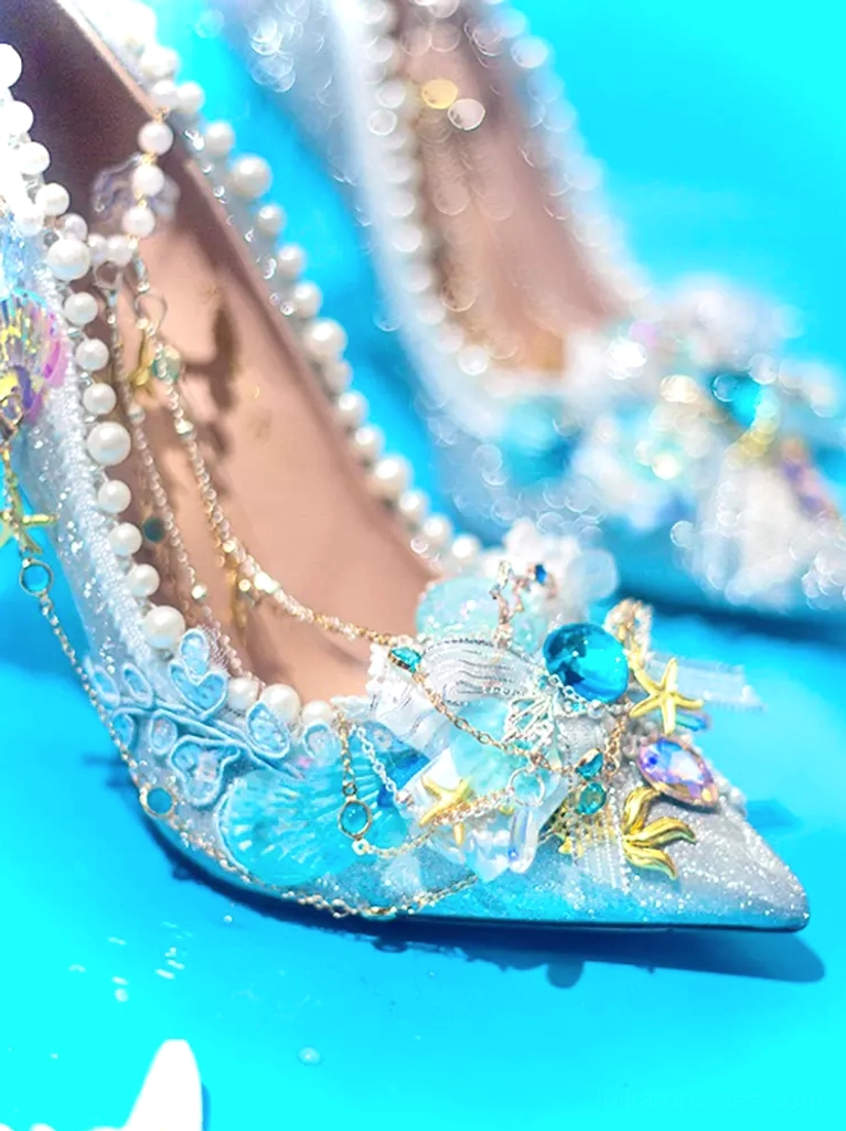 Mermaid Lolita pointed stiletto pumps side close-up sparkling crystals seashell starfish decorations pearl trim blue ocean table setting
