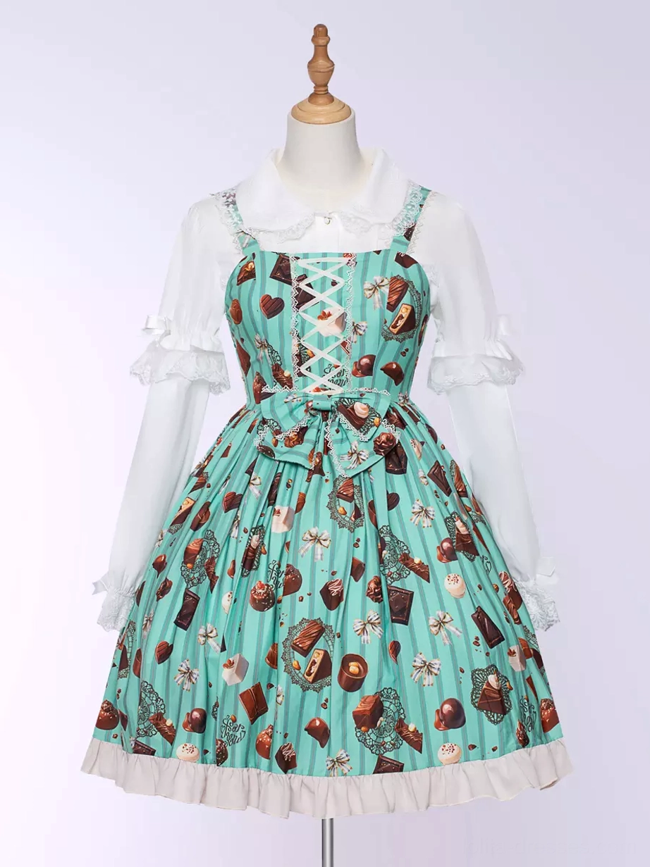 Mint green sweet Lolita chocolate cake print JSK dress mannequin studio front view showing dessert print ruffled hem waist bow