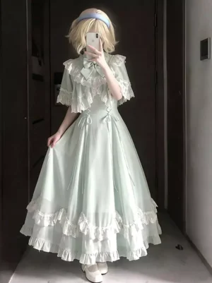 Model lifting mint green lolita dress skirt to show ruffled hemline construction and waist decorative bows detail, demonstrating sweet lolita silhouette volume