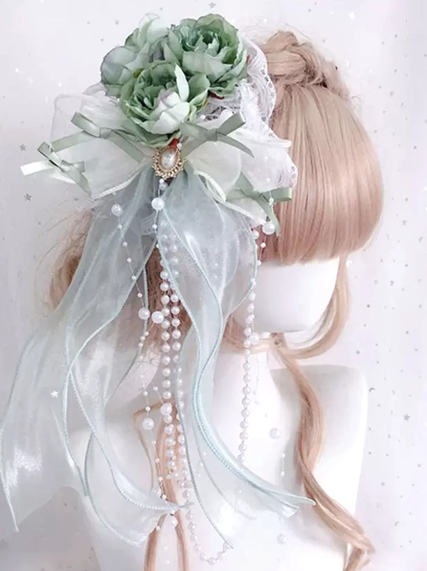Mint green elegant lolita headband featuring sheer ribbons, green artificial flowers and lustrous pearl chains, displayed on mannequin modeling classic lolita aesthetic with detailed lace trim embellishments
