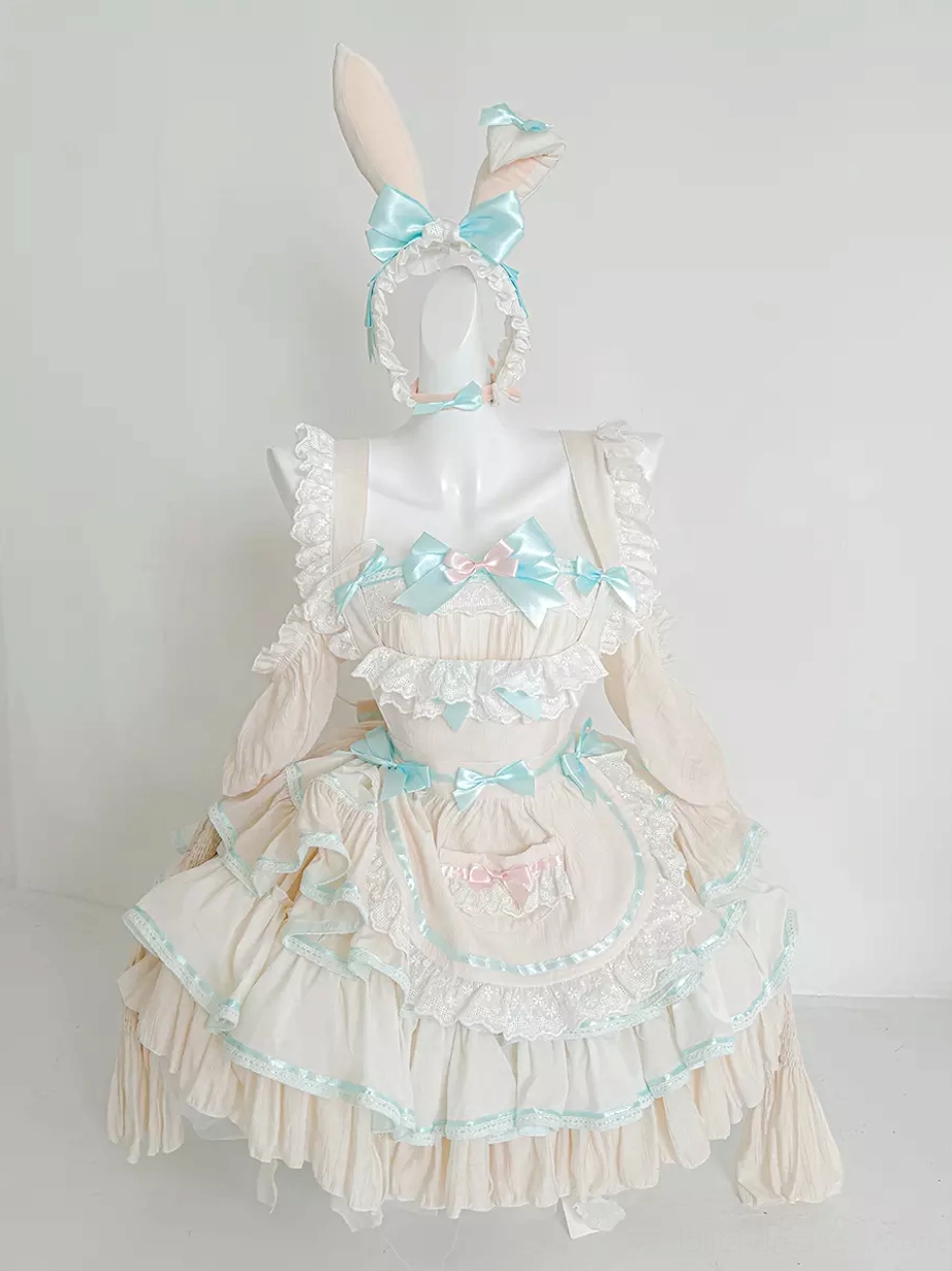 Mint green and white rabbit maid lolita dress with ruffled layered skirt worn on dress form with bunny ear headband, front view showing sweet kawaii aesthetic