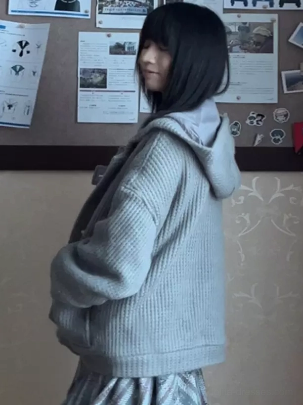 mist blue lolita hooded coat with waffle knit texture drop shoulder sleeves side full body view with bulletin board background
