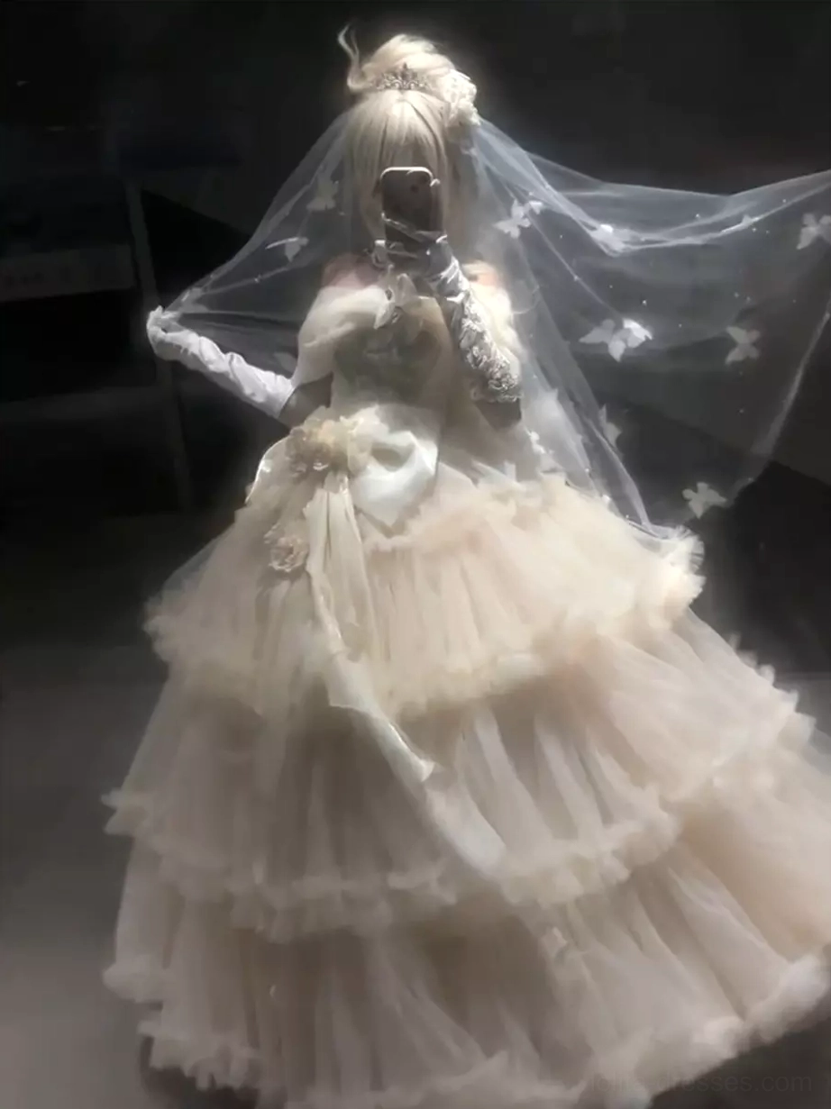 Model wearing champagne sweet lolita wedding dress off-shoulder design butterfly veil lace gloves front three-quarter