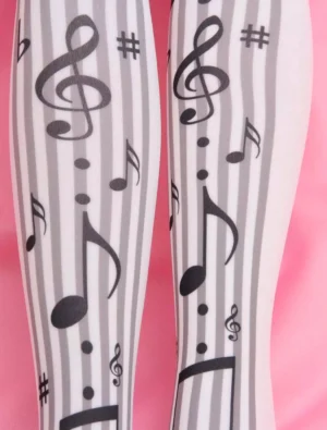 Close-up front view of black musical note printed lolita stockings featuring treble clef sharp symbols detailed print design on white striped base