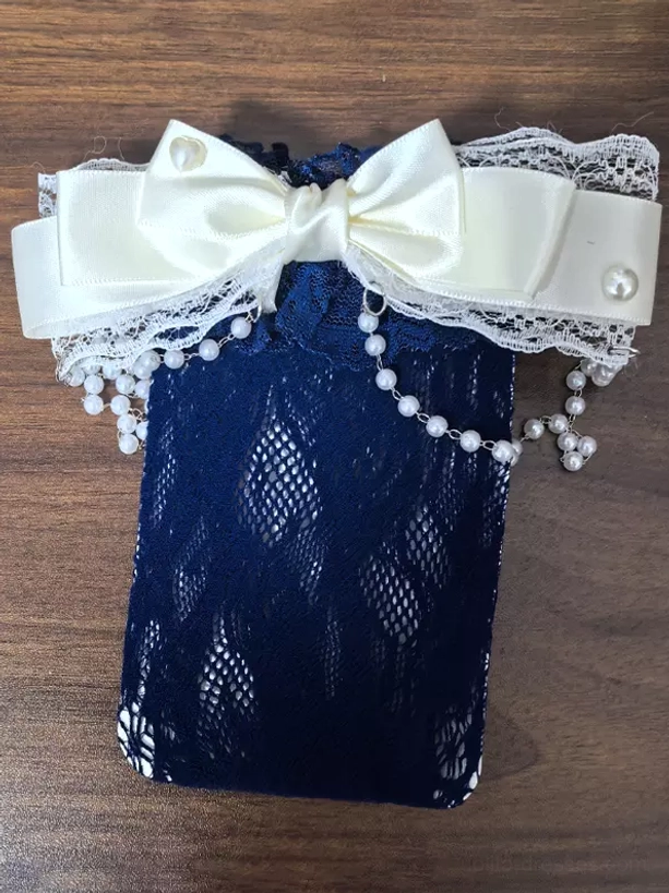 Navy blue lolita socks with diamond hollow lace fabric off-white satin bow white lace edge and pearl tassel flat lay display