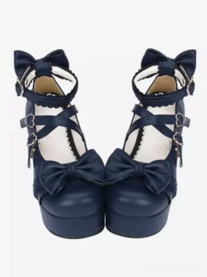 Navy blue Lolita chunky platform heels with heart-buckle ankle straps and front bow decorations displayed in flat lay on white background