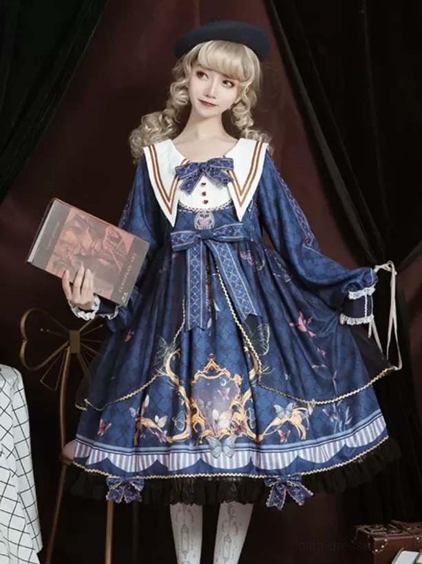 Navy sailor academic lolita OP dress front view with butterfly print, sailor collar, front bowknot, lace ruffles, and long sleeves on model with blonde hair