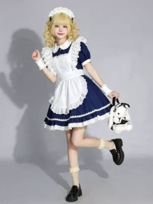 Navy blue sweet lolita maid dress with puff sleeves front three-quarter view on blonde model wearing maid headband white lace apron bunny plush toy