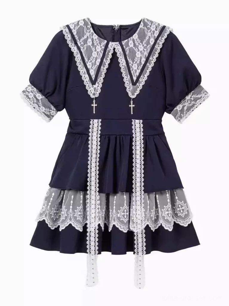 Flat lay product display of navy blue and white gothic lolita sailor dress on pure white background showing cross pendant and lace splicing details