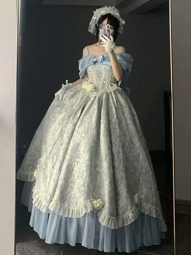 Off-shoulder corset sweet lolita gown with light blue and off-white jacquard pattern, model taking mirror selfie wearing bonnet, displaying layered ruffled skirt hem and structured bodice
