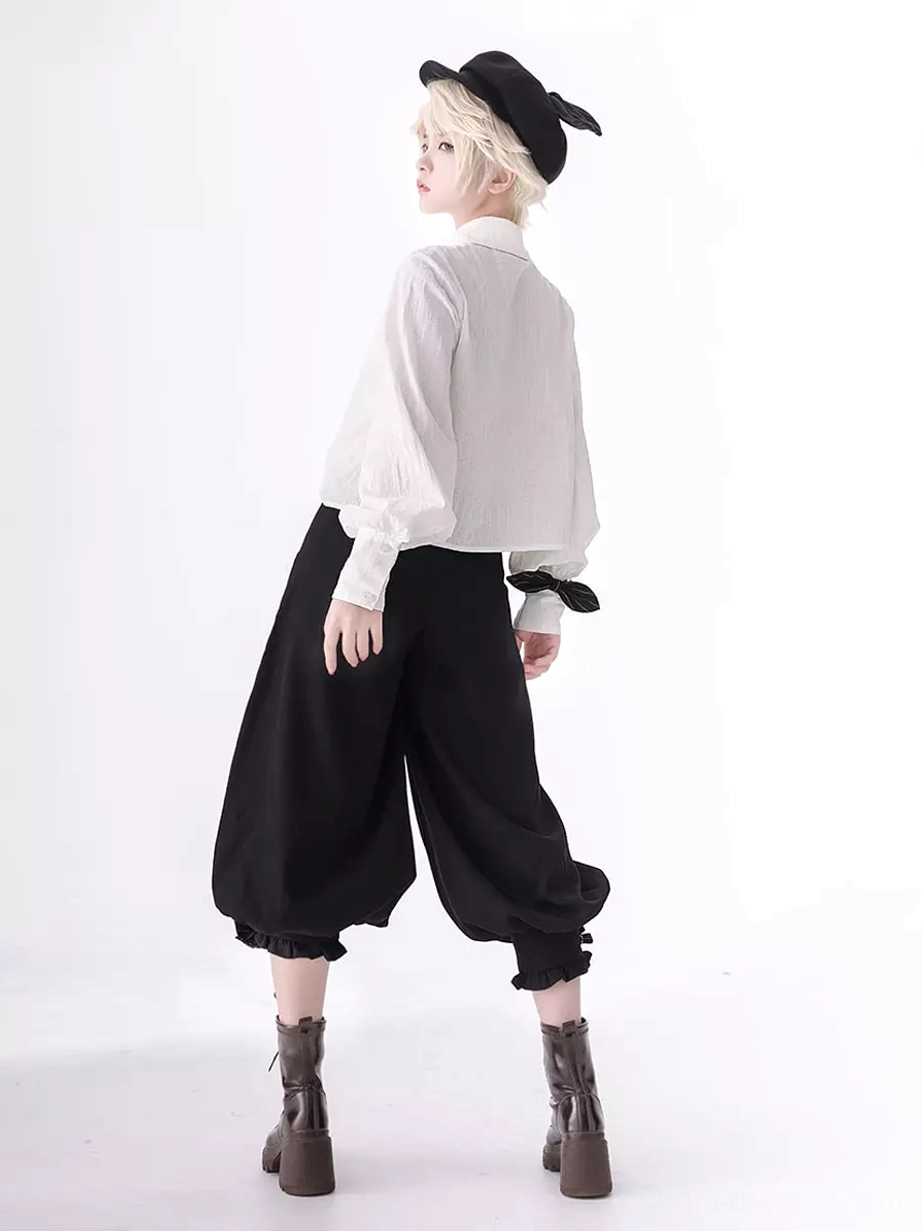 Back view of ouji blouse with bow decorated cuffs and long sleeves showing construction details and back silhouette