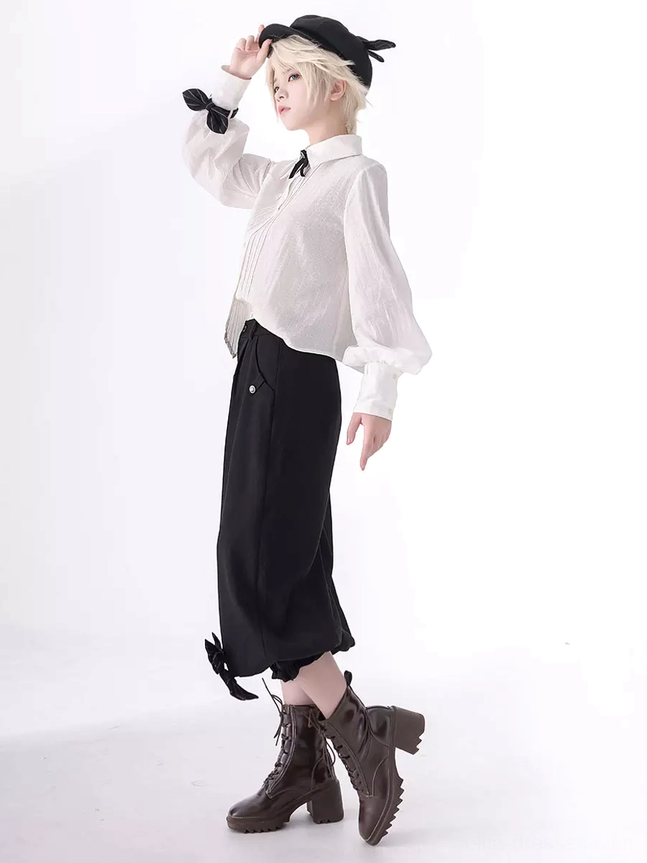 Long sleeve ouji blouse side profile view showing pointed hem silhouette with ankle bow pants and platform boots