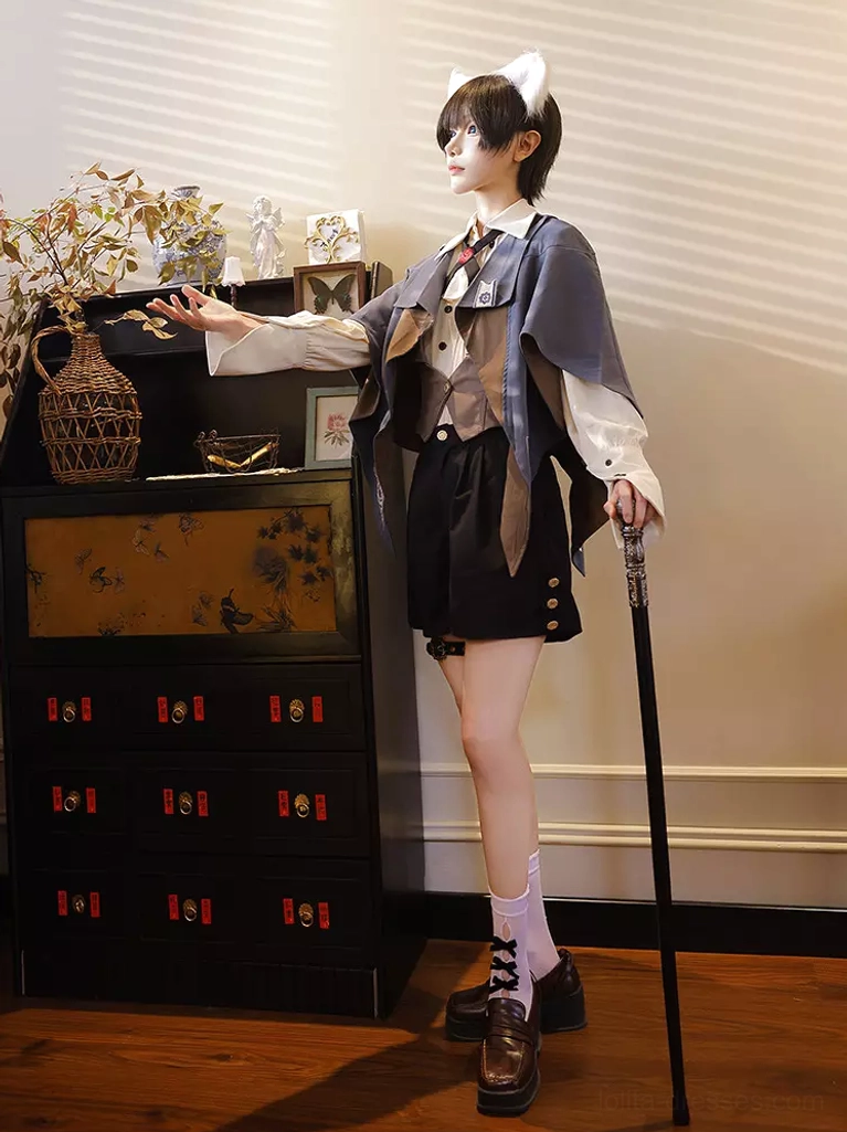 Ouji lolita formal cape coat showing asymmetrical cut and formal dress structure for authentic aristocratic gentlemen styling