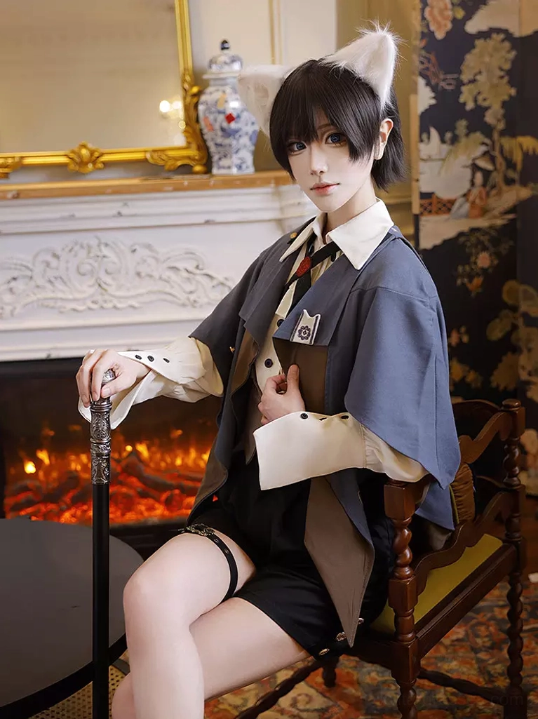 Ouji lolita formal suit showcasing sleeve details with embroidery and the long formal sleeve construction in dark navy