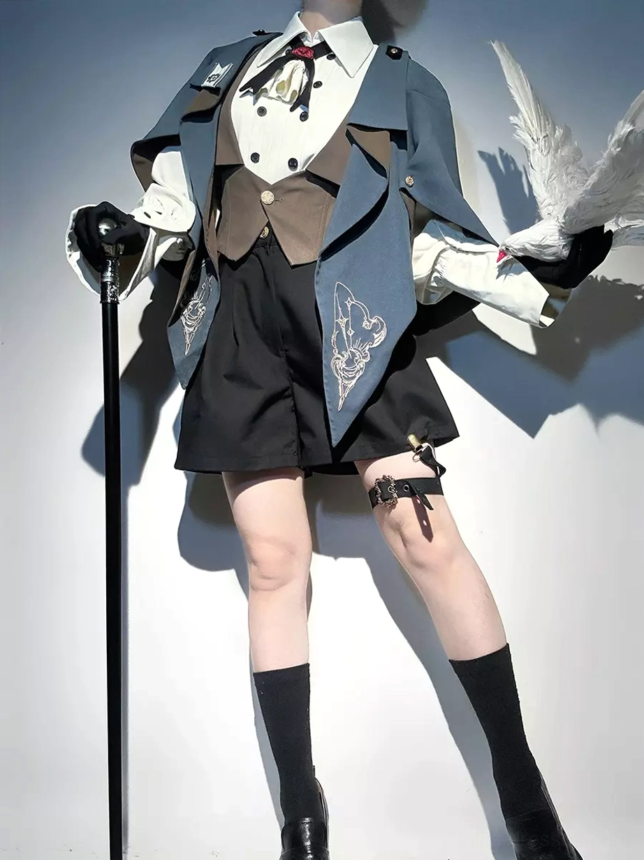 Victorian-inspired ouji lolita formal suit side three-quarter view with embroidered cape lapels and high-waisted black shorts with side buttons