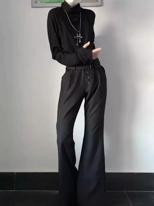 Side front three-quarter view of black ouji lolita wide-leg flare trousers showing elegant proportions and waist belt detail, paired with black turtleneck and cross necklace