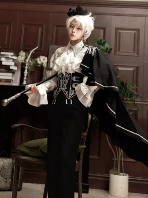 Gothic Ouji Lolita gentleman outfit three-quarter front angle model holding walking cane black cape silver edge trim ruffled collar formal trousers vintage interior