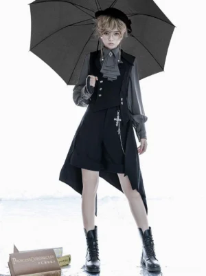 Ouji style lolita overcoat full front standing view double-breasted vest ascot tie cropped shorts combat boots holding black umbrella seaside book props