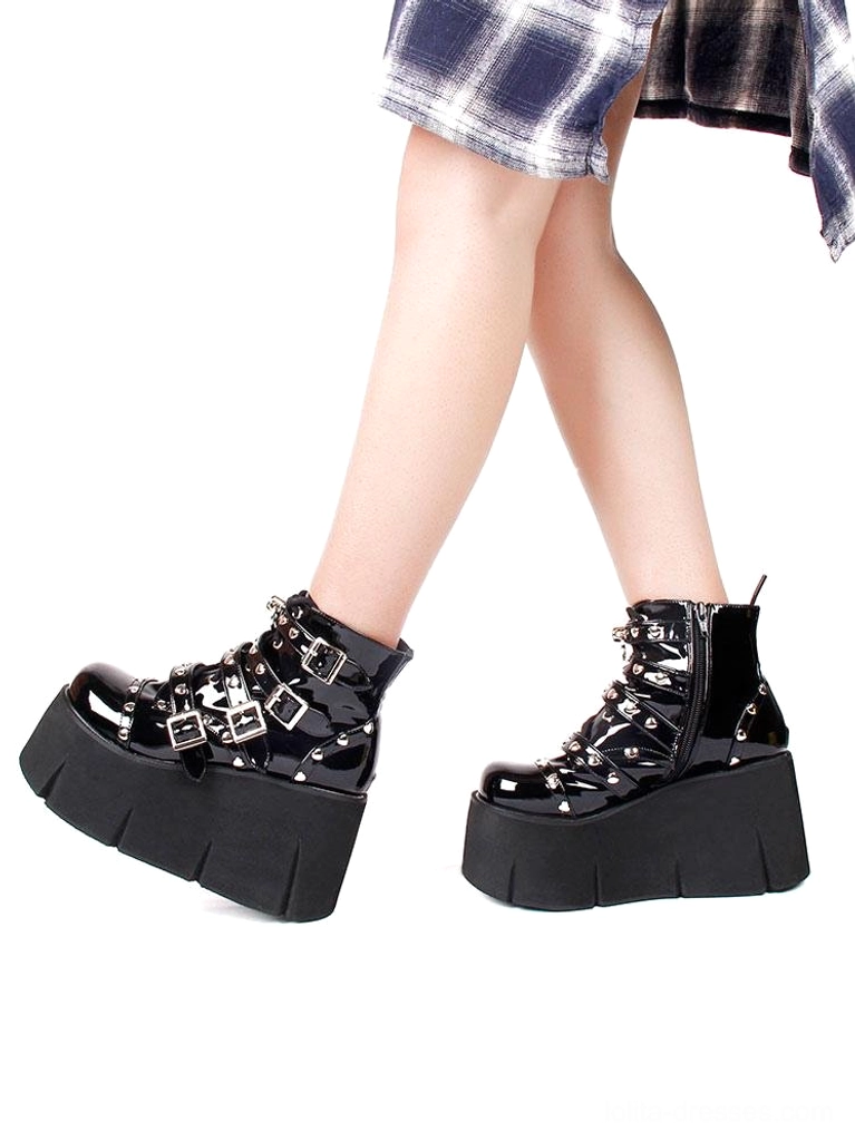 Punk platform ankle boots side profile double view worn footwear showing black patent leather chunky platform heel height