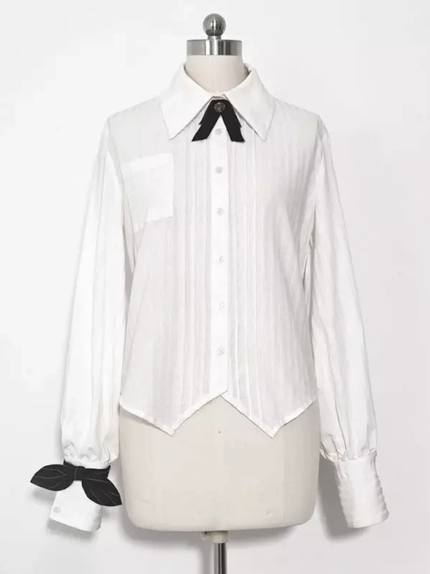 Single long sleeve ouji blouse on mannequin display showing pleated front pointed hem bow tie and cuff bow decorations