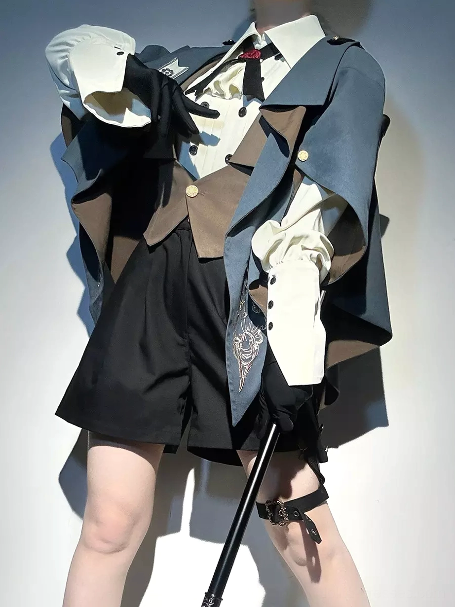 Close-up front view of ouji lolita suit showing detailed embroidery on coat, tailored brown waistcoat, and high-waisted formal shorts