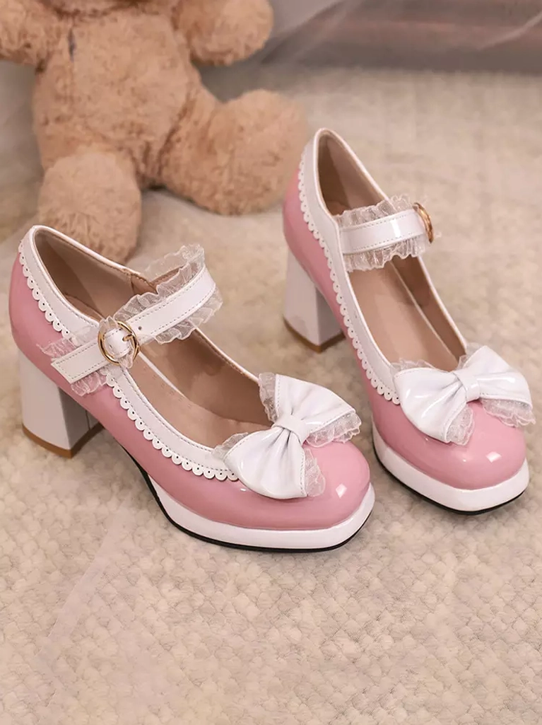 Pair of pink and black-white Lolita chunky heel Mary Jane pumps placed side by side on carpet with teddy bear